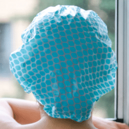 Woman wearing Urban Spa Shower Cap