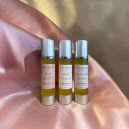 Bath & Body Oil Trio on soft pink silk
